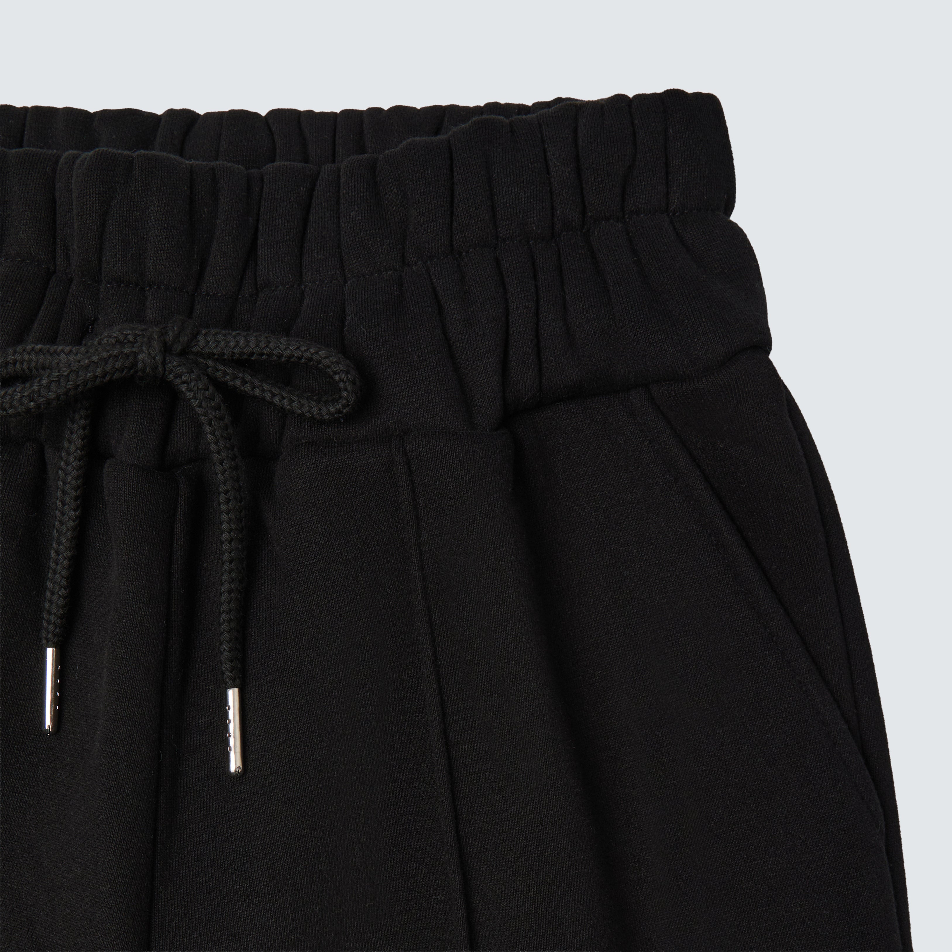 Black straight leg relaxed fit womens joggers with pockets, drawstring and elasticated waist. 